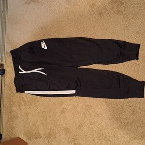 Nike size small jogger black with white stipe with pockets
